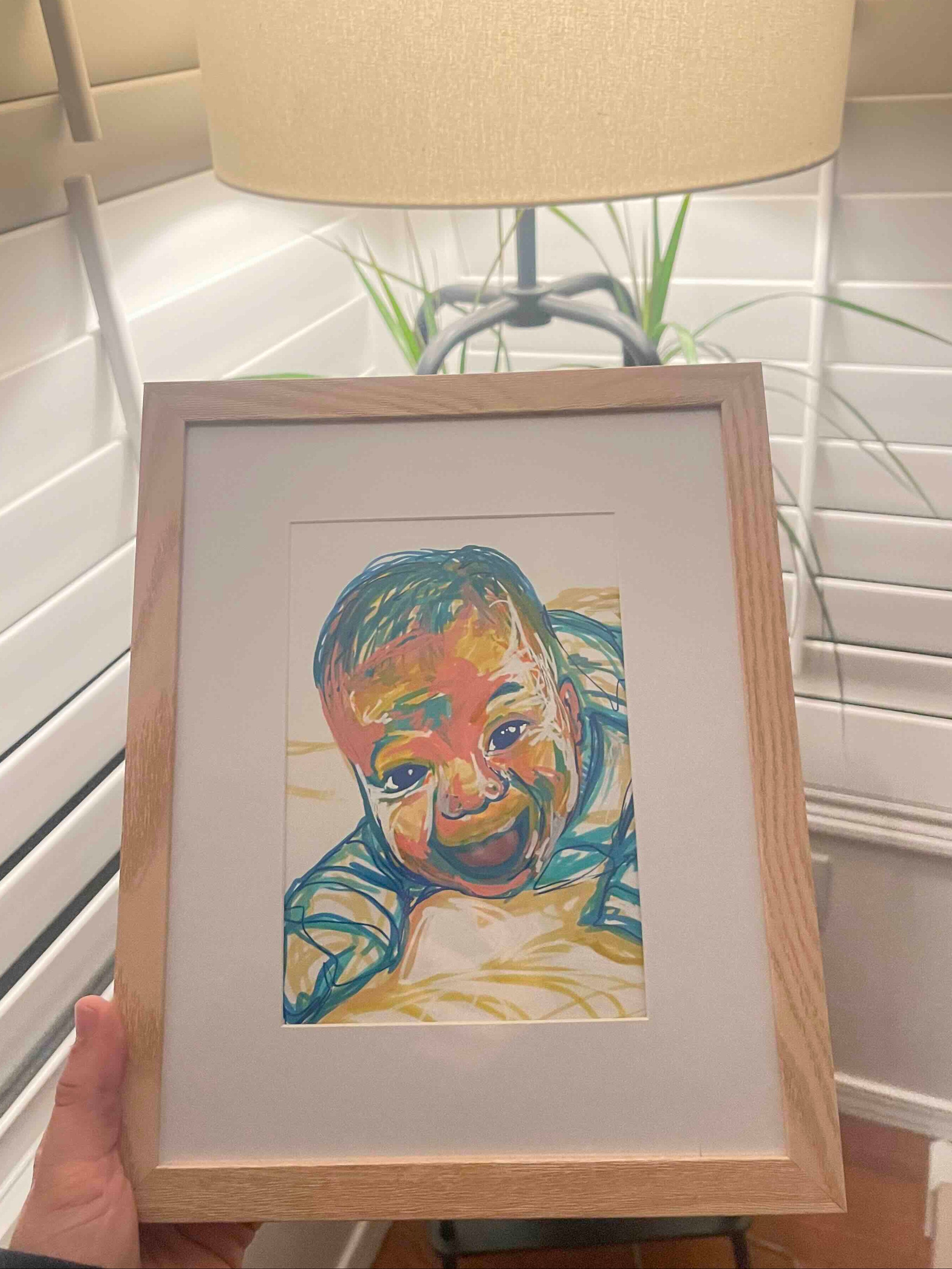 Framed artwork of a newborn baby 